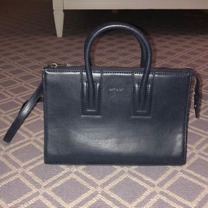 navy handbag with strap